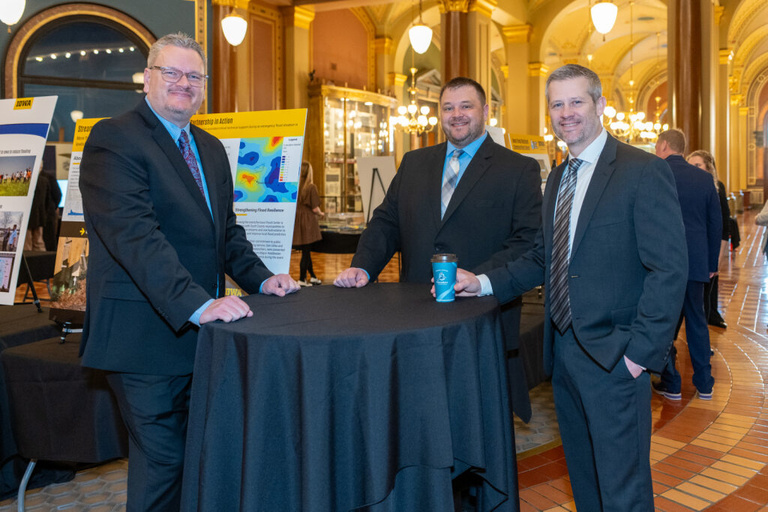 IFC staff converses with visitors at the Legislative Breakfast event at the Iowa State Capital Rotunda