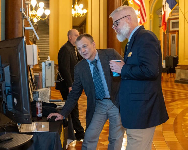 IFC staff showcases the Iowa Flood Information System at the Legislative Breakfast event at the Iowa State Capital Rotunda