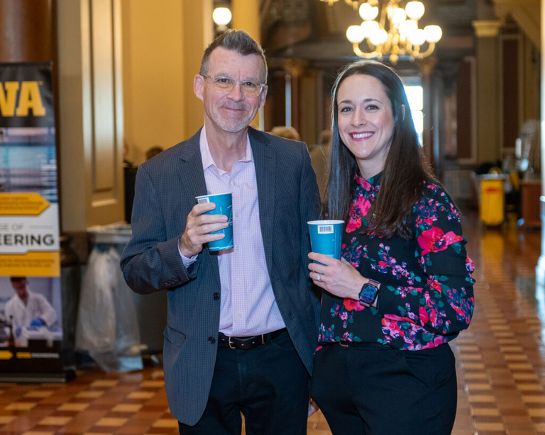 IFC staff poses with a partner at the Legislative Breakfast event at the Iowa State Capital Rotunda