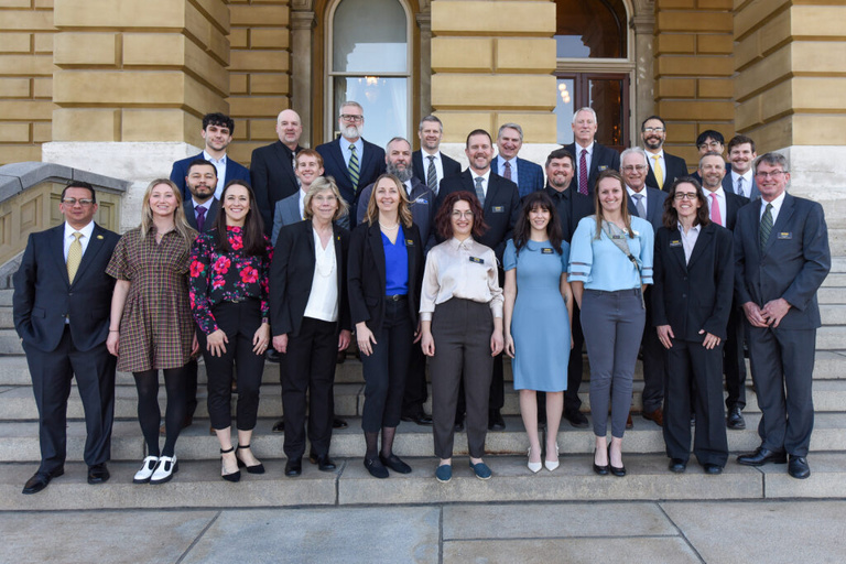The IFC and IGS team members pose as a group on the Capital's front stairs