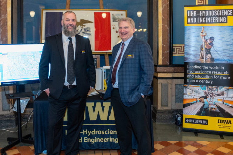 IIHR staff smile at the Legislative Breakfast event at the Iowa State Capital Rotunda