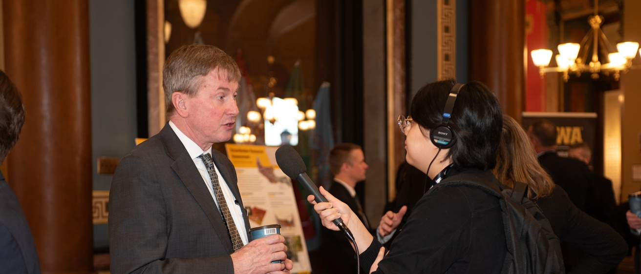 Larry Weber speaks to a Capital Dispatch interviewer at the IFC Legislative Breakfast