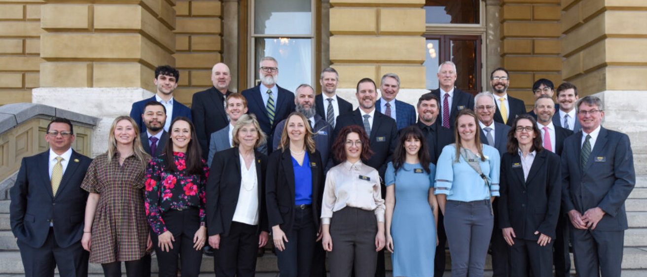 The IFC and IGS team members pose as a group on the Capital's front stairs