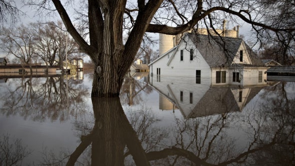 Flood waters surround a home