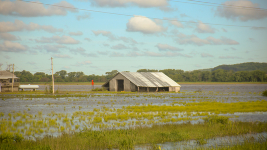 A building in a flooded field